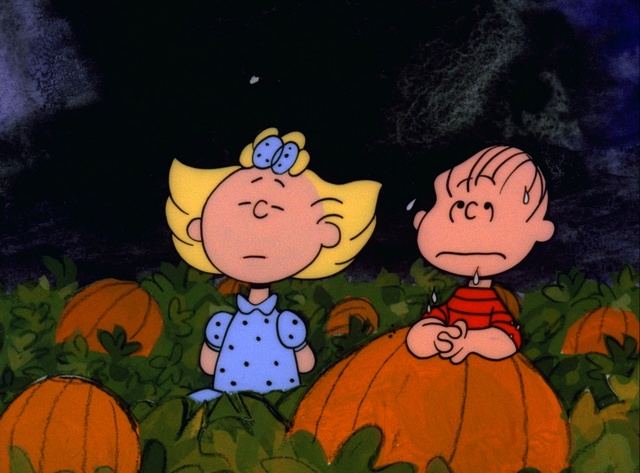 LINUS AND SALLY WAIT IN THE PUMPKIN PATCH FOR THE GREAT PUMPKIN TO APPEAR